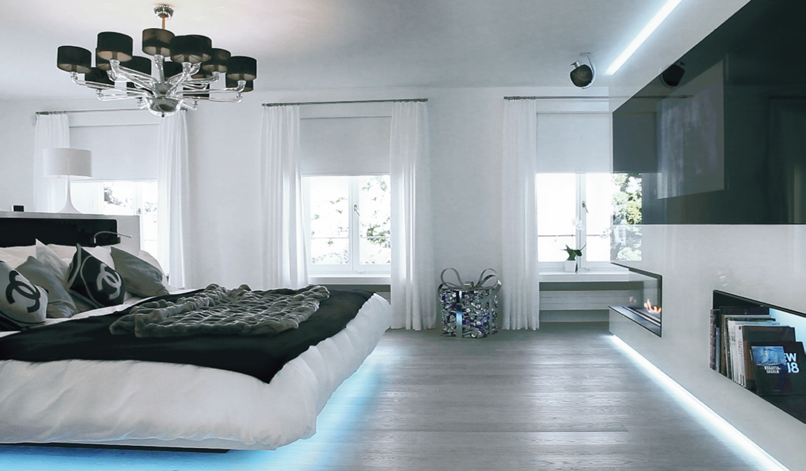 Master bedroom with chandelier and lakeside light
